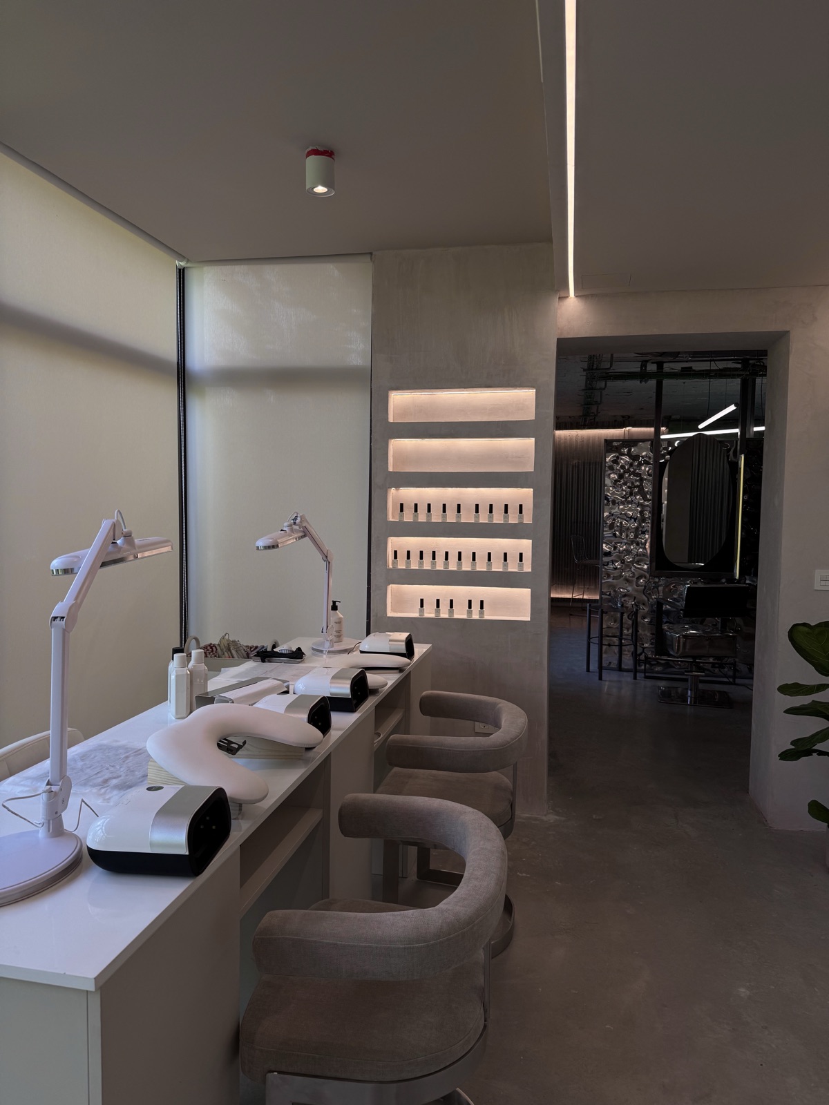 Beauty station with chrome and concrete detailing